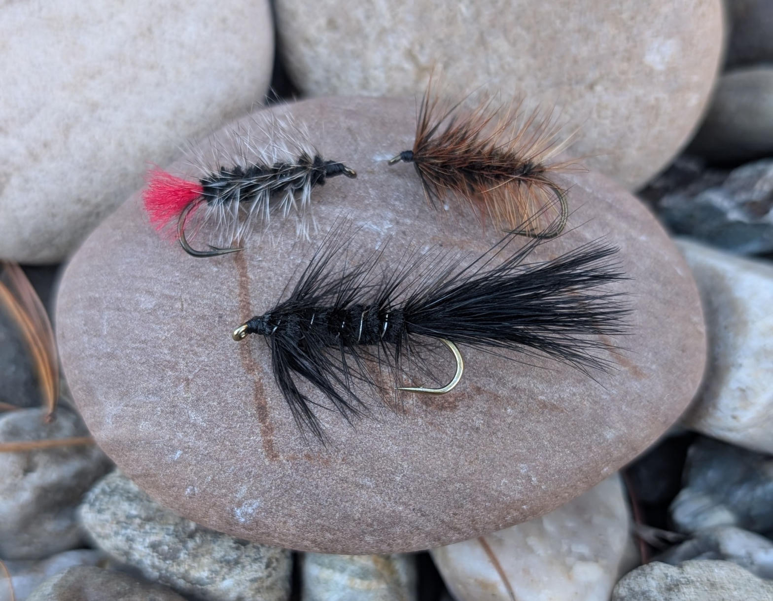 Woolly Bugger streamer flies on a rock